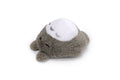Plush toy resembling a seal with a white face on a white background