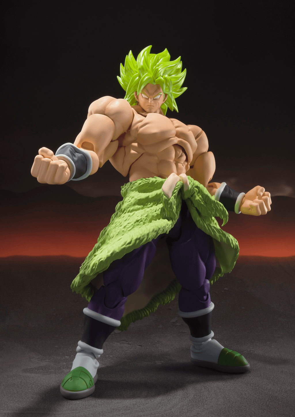 Action figure of a character with green hair and outfit on a dark background