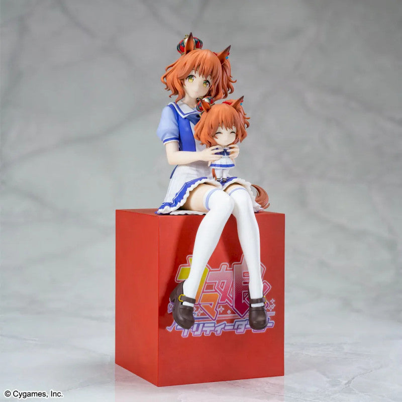 Anime figurine on a red box with a gray background