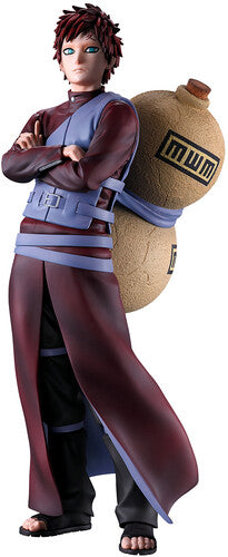 Action figure of a character from a popular anime series, standing with arms crossed and a large bag on his back.