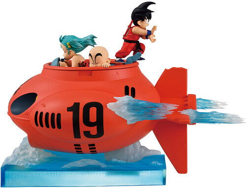 Toy figure of a red submarine with characters on top, on a white background