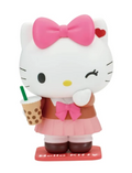 Hello Kitty collectible figure in a brown and pink outfit, holding a bubble tea cup, on a white background.