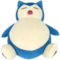 A blue and cream Snorlax plush toy sitting upright against a plain white background.