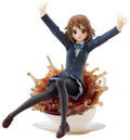 Figurine of a character in a school uniform sitting on a bowl with a white background