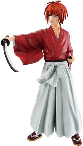 Figure of a character in red kimono with white pants holding a sword on a white background