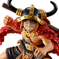 Action figure with a red and black outfit and gold helmet on a white background