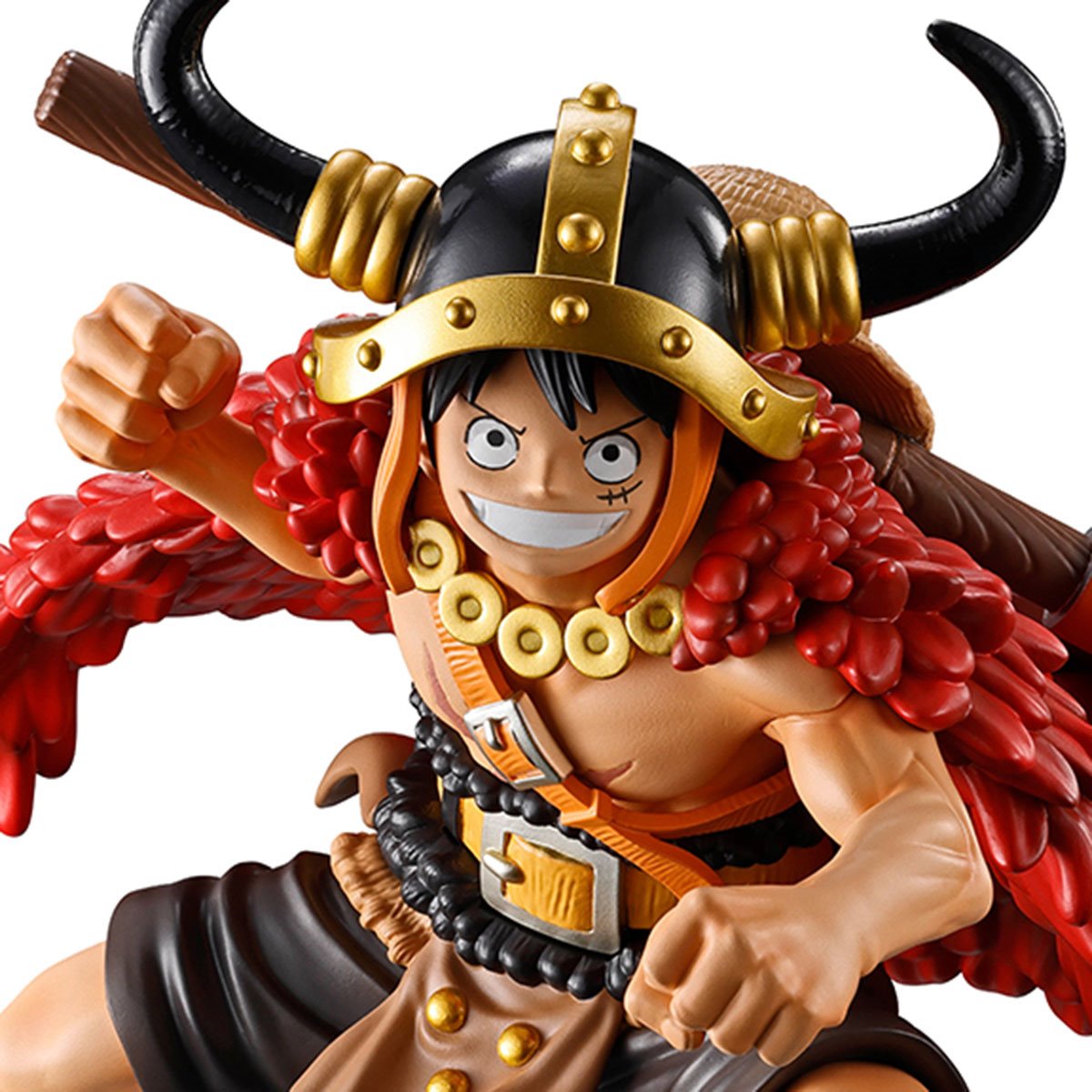 Action figure with a red and black outfit and gold helmet on a white background