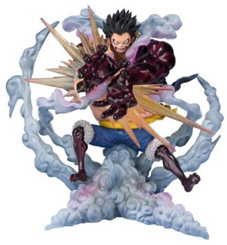 Action figure of a character with spiky hair and dramatic pose on a cloud-like background