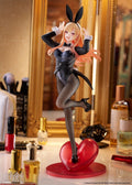 Anime character figurine with bunny ears on a red heart-shaped base in a decorative setting.