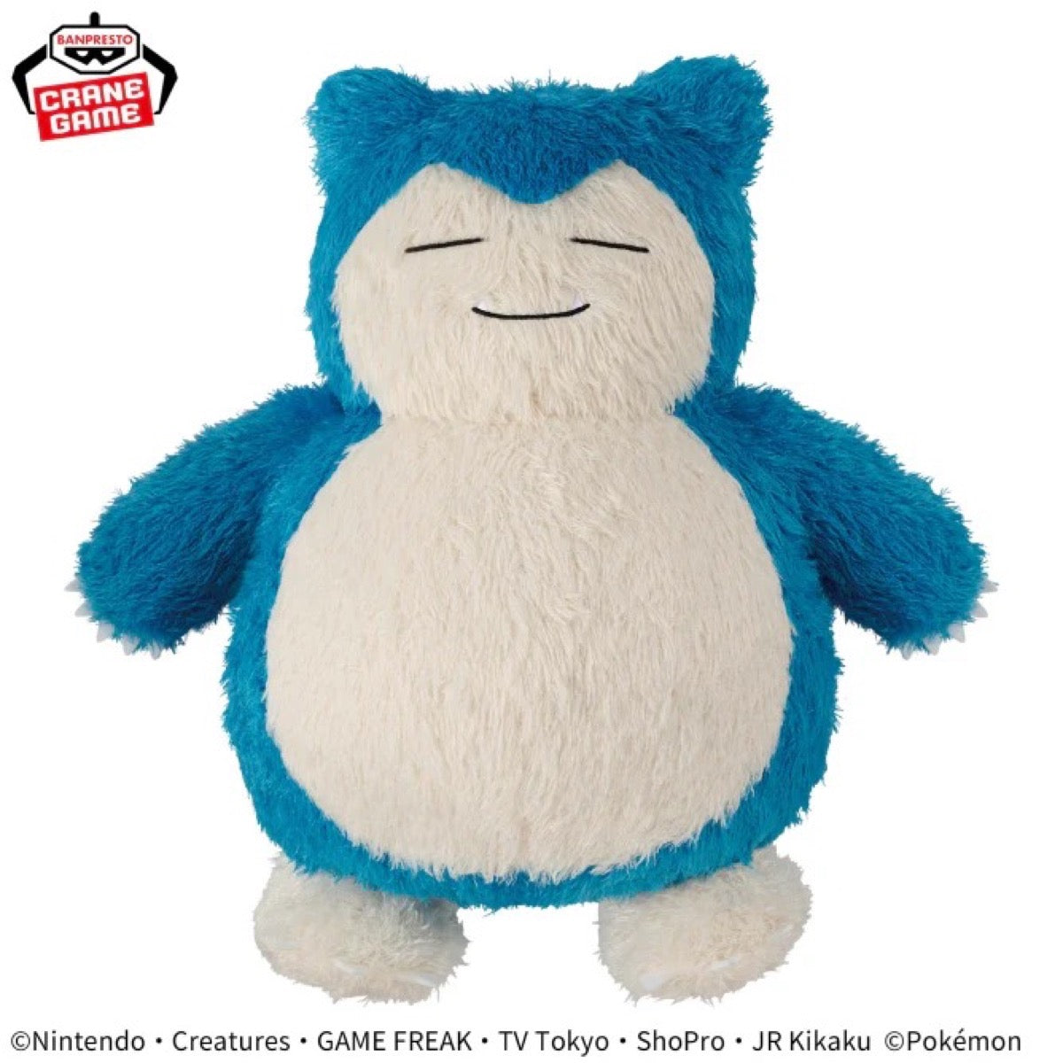A blue and white fluffy Snorlax plush toy from the Pokémon franchise, shown against a plain white background with a Crane Game logo in the top-left corner.