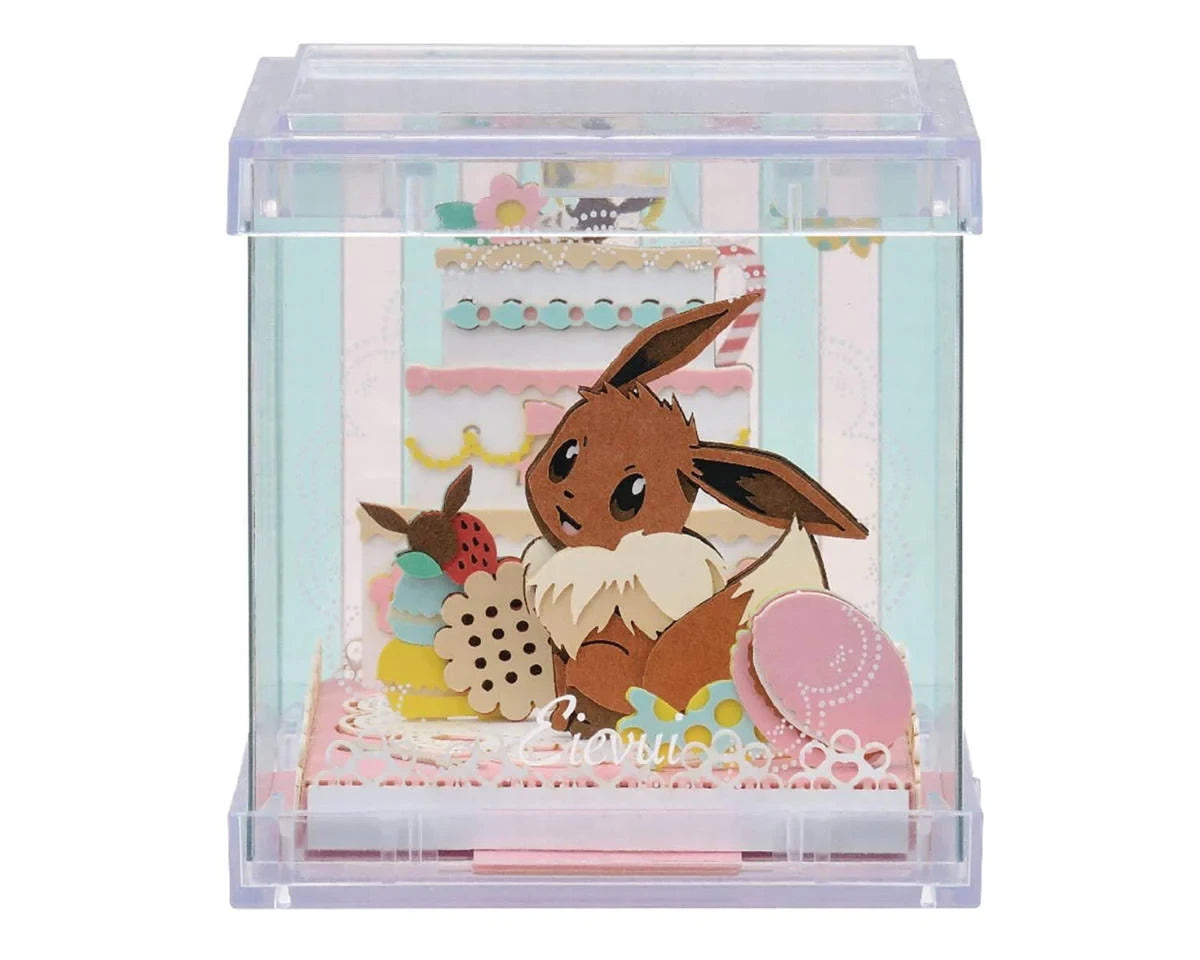 A clear acrylic display box containing a pastel-colored decorative scene with a brown bunny character, pink and cream layered elements, and small decorative accents. The box is photographed on a plain white background.