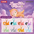 A product display card for the 'Lazy Time Mini' by Puremind, featuring a large illustration of a pink-haired anime character in a yellow dress on a purple cloud background, with eight smaller mini figures in various colors shown below.