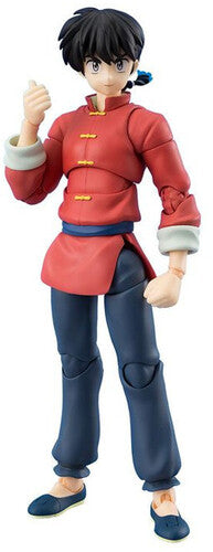Action figure in a red outfit with blue pants on a white background