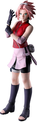 Action figure of a character in a red and pink outfit with black gloves and boots.