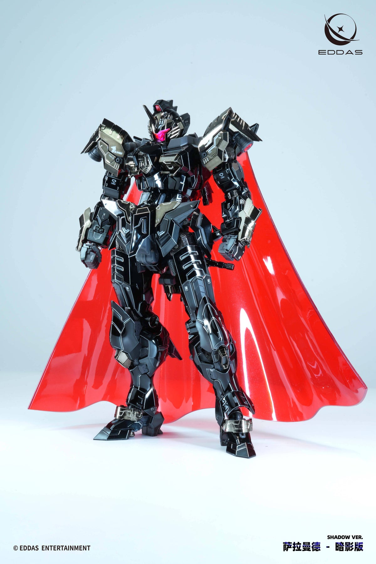 A highly detailed EDOAS Shadow Vail mecha action figure, featuring a black and gray metallic body with a prominent glossy red cape, posed against a clean light gray studio background.