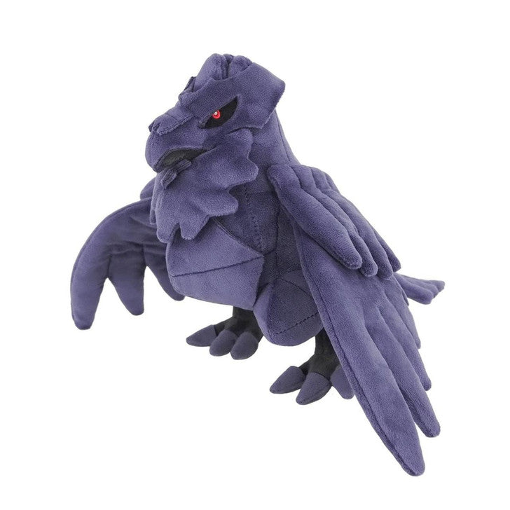 Plush toy dragon with purple feathers on a white background