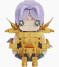 A small block-built anime-style character figure with lavender hair, green eyes, and gold armor, centered on a plain white background.