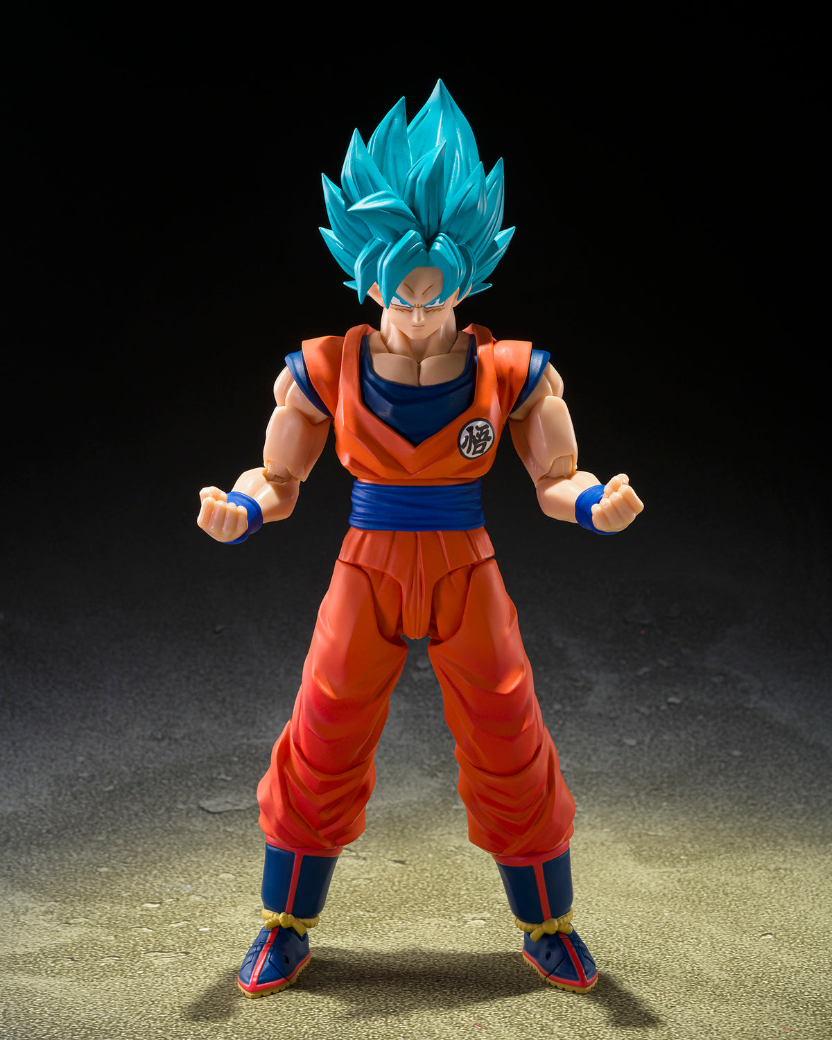Action figure with blue hair and orange outfit on a dark background
