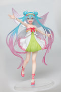 Animated character figurine with long blue and pink hair, wearing a colorful dress on a white background