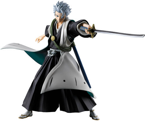 Anime character figurine in traditional outfit with sword on a white background
