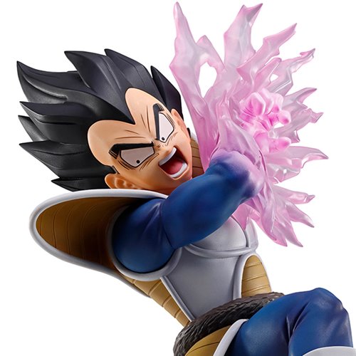 A collectible figurine of Vegeta from Dragon Ball Z in a dynamic pose, showing his black hair, blue and white armor, and a pink energy blast effect, isolated on a white background.
